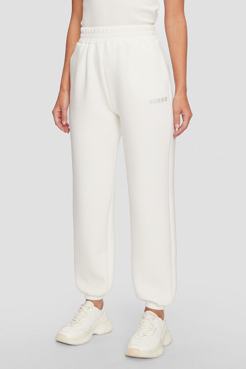 GUESS Dresowe damskie spodnie w kolorze ecru Cecilia Scuba