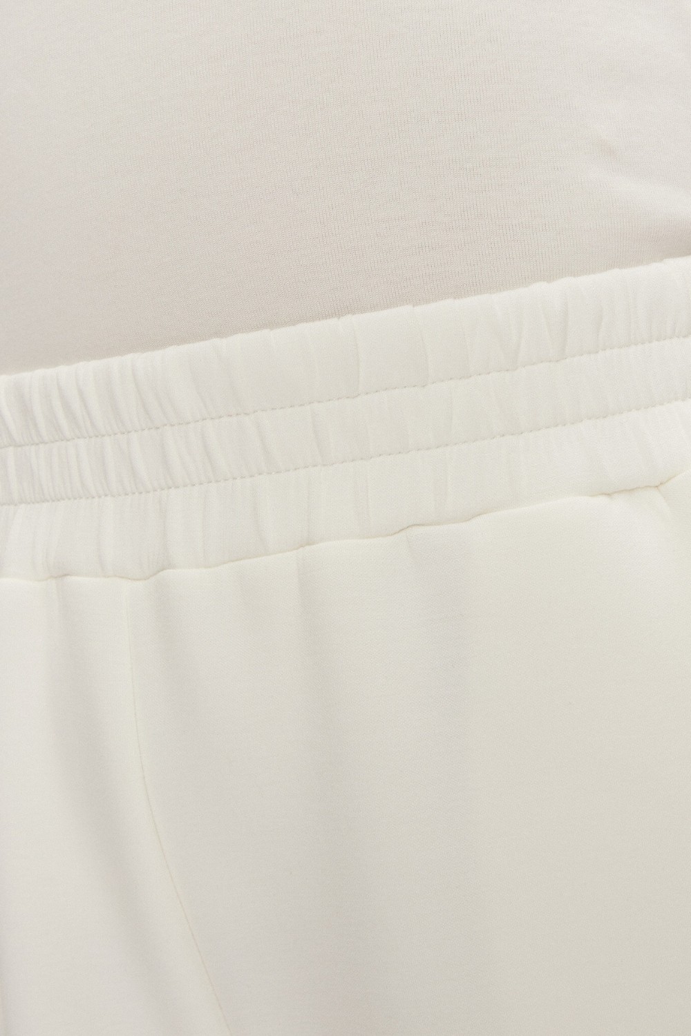 GUESS Dresowe damskie spodnie w kolorze ecru Cecilia Scuba